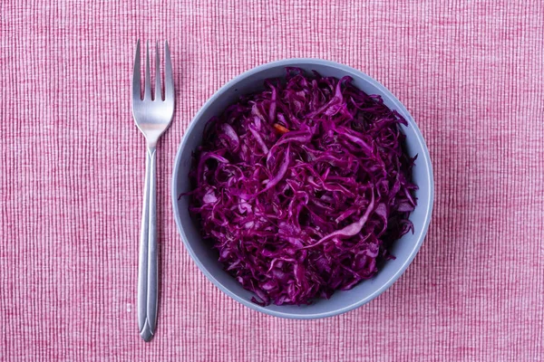 Fork and sauerkraut on cloth — Stock Photo, Image