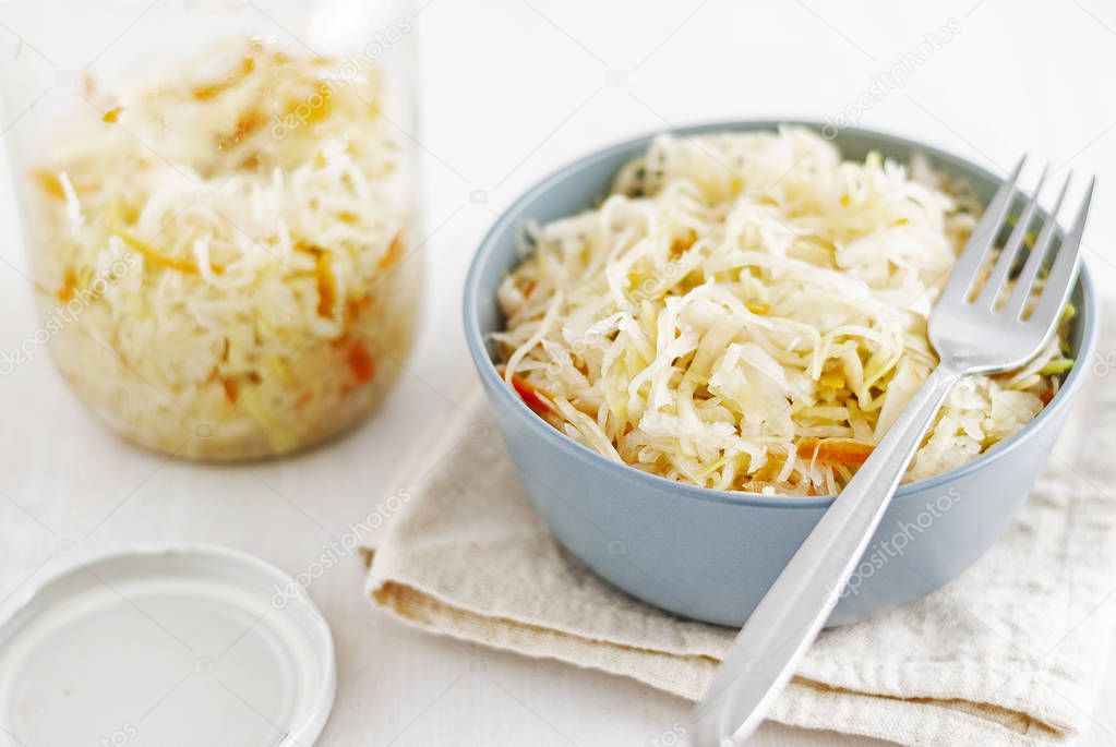 Jar and bowl with sauerkraut