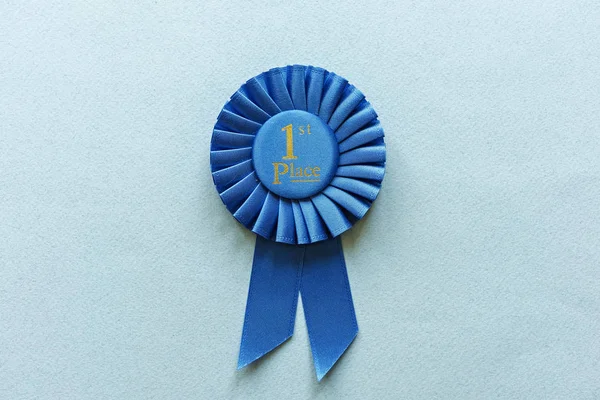 Champion or Winners 1st Place blue rosette — Stock Photo, Image