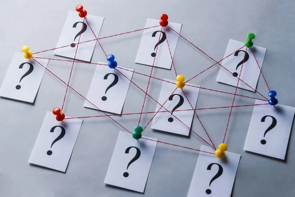 Network of printed question marks on white cards — Stock Photo, Image