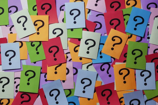 Background texture of multicolored question marks