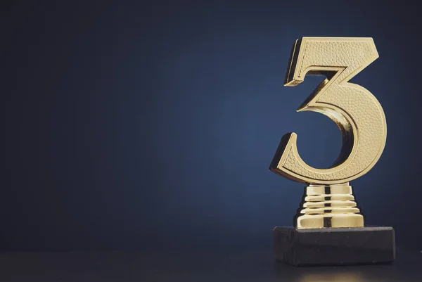 Isolated gold colored statue of number 3 — Stock Photo, Image