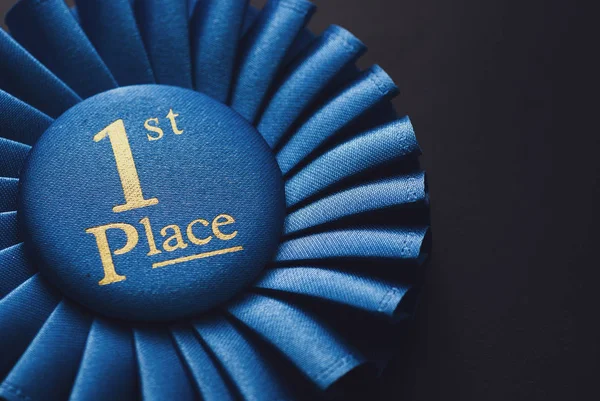 Champion 1St Place Blue Rosette Gold Text Black Background — Stock Photo, Image