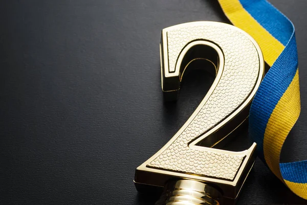 Gold trophy in the form of a number two — Stock Photo, Image