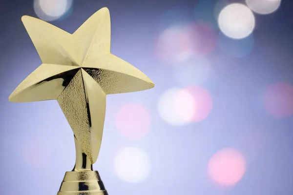 Textured gold star on a trophy award