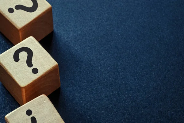Side border of question marks on wooden cubes — Stock Photo, Image