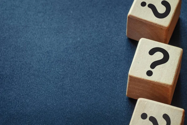 Side border of question marks on wooden cubes — Stock Photo, Image