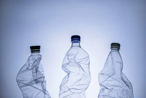 Three empty clear wet plastic bottles — Stock Photo, Image