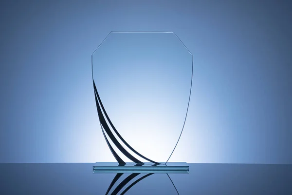 Elegant Blank Glass Shield Trophy Dark Blue Background Ready Engraved — Stock Photo, Image