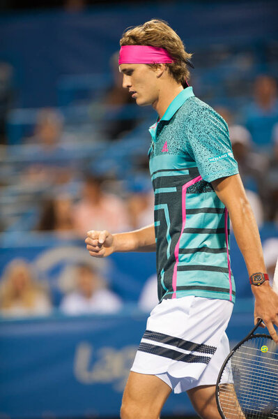 Alexander Zverev (GER) goes up against Malek Jaziri (TUN) until their match is suspended due to rain at the Citi Open tennis tournament on July 31, 2018 in Washington DC