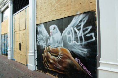 A mural on a boarded-up storefront in Washington DC shows support for the Black Lives Matter movement clipart