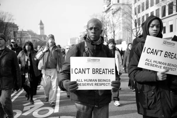 Demonstrators show support for the Black Lives Matter movement in Washington DC on December 13, 2014