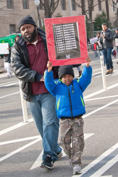 Demonstrators show support for the Black Lives Matter movement in Washington DC on December 13, 2014