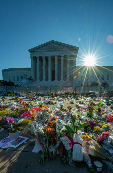 Notes and flowers are left at the Supreme Court of the United States in memory of the late Supreme Court Justice Ruth Bader Ginsburg in Washington DC on September 20, 2020