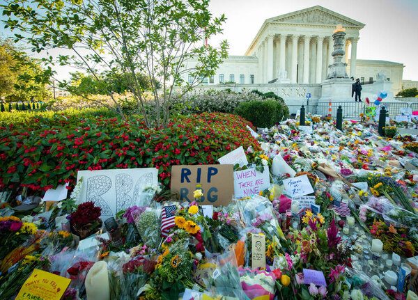 Notes and flowers are left at the Supreme Court of the United States in memory of the late Supreme Court Justice Ruth Bader Ginsburg in Washington DC on September 20, 2020