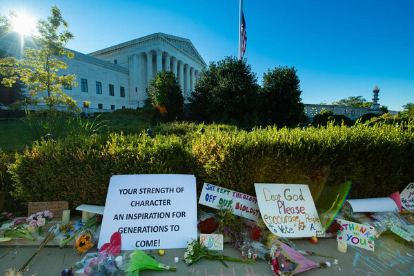 Notes and flowers are left at the Supreme Court of the United States in memory of the late Supreme Court Justice Ruth Bader Ginsburg in Washington DC on September 20, 2020