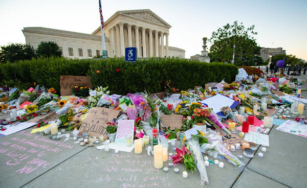 Notes and flowers are left at the Supreme Court of the United States in memory of the late Supreme Court Justice Ruth Bader Ginsburg in Washington DC on September 20, 2020