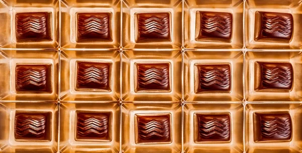 Chocolates pralines in gold box — Stock Photo, Image