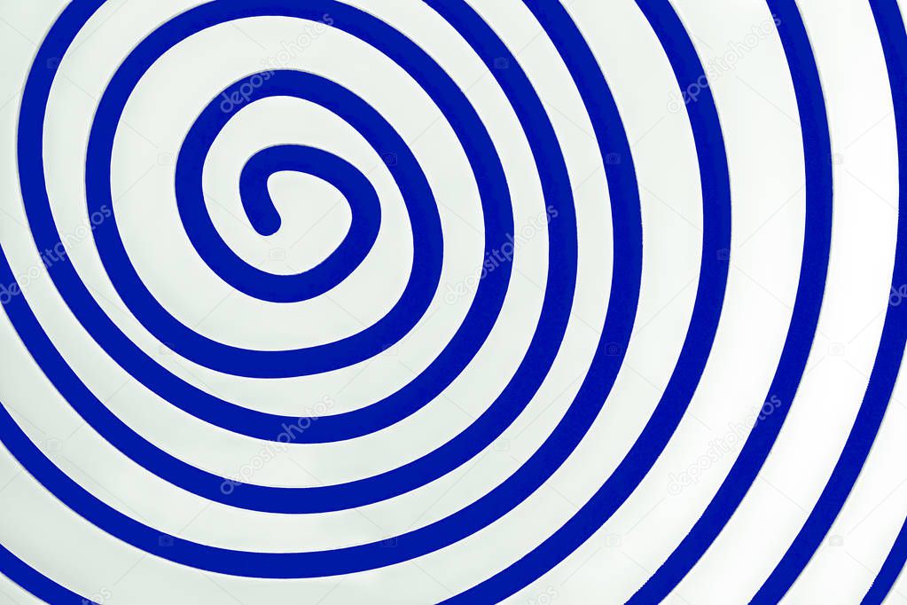 Simple white spiral on blue background