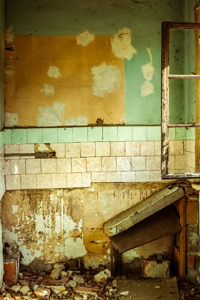 Old dilapidated kitchen in an abandoned house