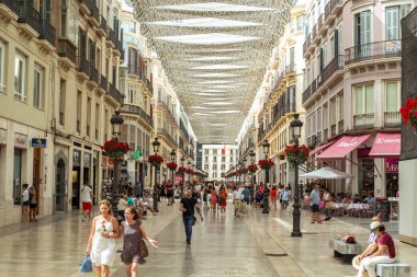 People on the Marques de Larios pedestrian street clipart
