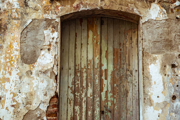 Old door with peeled paint
