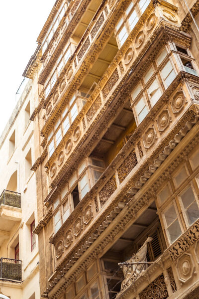Valletta Malta, July 16 2019. Traditional architecture in Valletta Old Town in Malta, street with traditional balconies and old buildings in historical city of Malta.