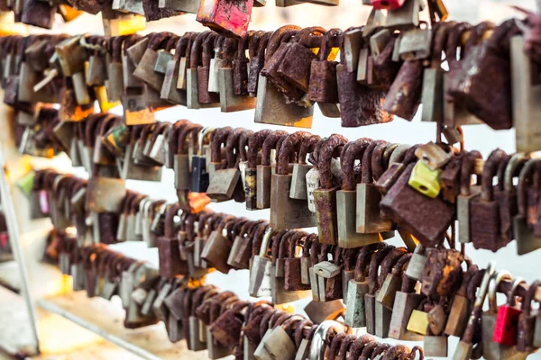 Rows of wedding locks hanged on the railing of love bridge — Stock Photo, Image