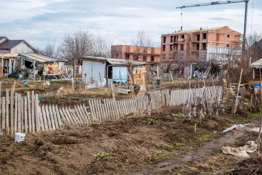 Sibiu, Romania - January 30, 2025. Abandoned places and garbage on the edge of the city near new residential areas, soil and water pollution affecting local ecosystems
