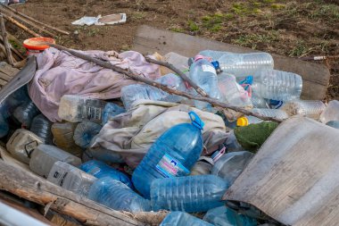 Sibiu, Romania - January 30, 2025. Abandoned places and garbage on the edge of the city near new residential areas, soil and water pollution affecting local ecosystems