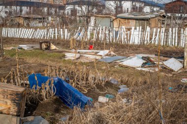 Sibiu, Romania - January 30, 2025. Abandoned places and garbage on the edge of the city near new residential areas, soil and water pollution affecting local ecosystems