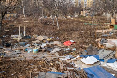 Sibiu, Romania - January 30, 2025. Abandoned places and garbage on the edge of the city near new residential areas, soil and water pollution affecting local ecosystems