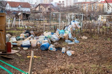 Sibiu, Romania - January 30, 2025. Abandoned places and garbage on the edge of the city near new residential areas, soil and water pollution affecting local ecosystems