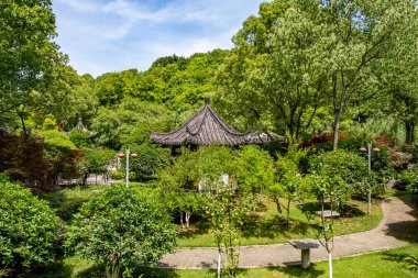 Chongqing, China - May 02, 2025 Chongqing Garden Expo Park is a thoughtfully designed combination of ecological restoration, cultural exhibit, and horticultural artistry, Yubei District Longjing Lake