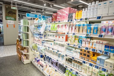 Chongqing, China  May 09, 2025. a vibrant snapshot of a well-stocked supermarket aislewith shelves filled top to bottom with a variety of goods