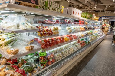 Chongqing, China  May 09, 2025. a vibrant snapshot of a well-stocked supermarket aislewith shelves filled top to bottom with a variety of goods