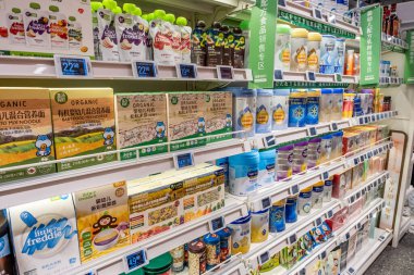 Chongqing, China  May 09, 2025. a vibrant snapshot of a well-stocked supermarket aislewith shelves filled top to bottom with a variety of goods