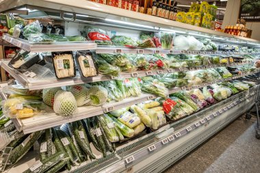 Chongqing, China  May 09, 2025. a vibrant snapshot of a well-stocked supermarket aislewith shelves filled top to bottom with a variety of goods
