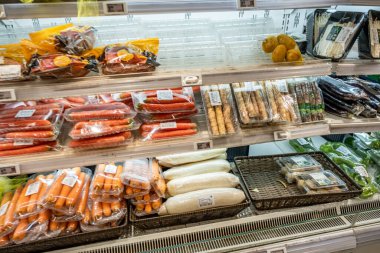 Chongqing, China  May 09, 2025. a vibrant snapshot of a well-stocked supermarket aislewith shelves filled top to bottom with a variety of goods