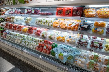 Chongqing, China  May 09, 2025. a vibrant snapshot of a well-stocked supermarket aislewith shelves filled top to bottom with a variety of goods