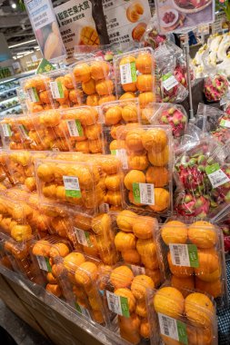 Chongqing, China  May 09, 2025. a vibrant snapshot of a well-stocked supermarket aislewith shelves filled top to bottom with a variety of goods