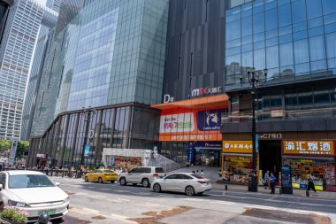 Chongqing, China - May 01 2025. Walking through a mega city with skyscrapers and charming historic buildings, in a vibrant tapestry of cultures, The streets are alive with a mix of locals and tourists
