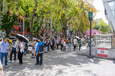 Chongqing, China - May 01 2025. Walking through a mega city with skyscrapers and charming historic buildings, in a vibrant tapestry of cultures, The streets are alive with a mix of locals and tourists