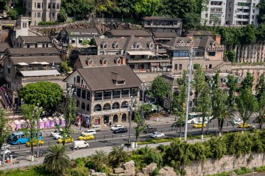 Chongqing, China - May 01 2025. Walking through a mega city with skyscrapers and charming historic buildings, in a vibrant tapestry of cultures, The streets are alive with a mix of locals and tourists