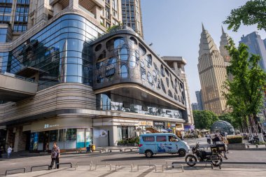 Chongqing, China - May 01 2025. Walking through a mega city with skyscrapers and charming historic buildings, in a vibrant tapestry of cultures, The streets are alive with a mix of locals and tourists