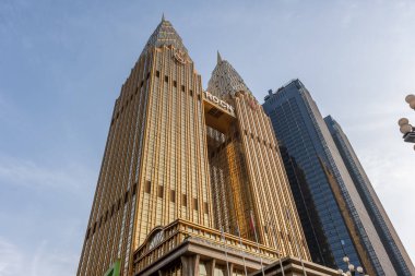 Chongqing, China - May 01 2025. Walking through a mega city with skyscrapers and charming historic buildings, in a vibrant tapestry of cultures, The streets are alive with a mix of locals and tourists