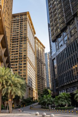 Chongqing, China - May 01 2025. Walking through a mega city with skyscrapers and charming historic buildings, in a vibrant tapestry of cultures, The streets are alive with a mix of locals and tourists