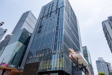 Chongqing, China - May 01 2025. Walking through a mega city with skyscrapers and charming historic buildings, in a vibrant tapestry of cultures, The streets are alive with a mix of locals and tourists