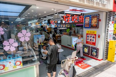 Chongqing, China - May 01 2025. Walking through a mega city with skyscrapers and charming historic buildings, in a vibrant tapestry of cultures, The streets are alive with a mix of locals and tourists