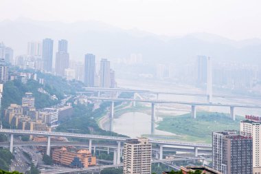 Chongqing, China - May 07, 2025 View from the rooftop of tall buildings in the Chongqing city, Chongqing is a giant city in southwestern China, founded at the confluence of the Yangtze and Jialingjiang rivers, China